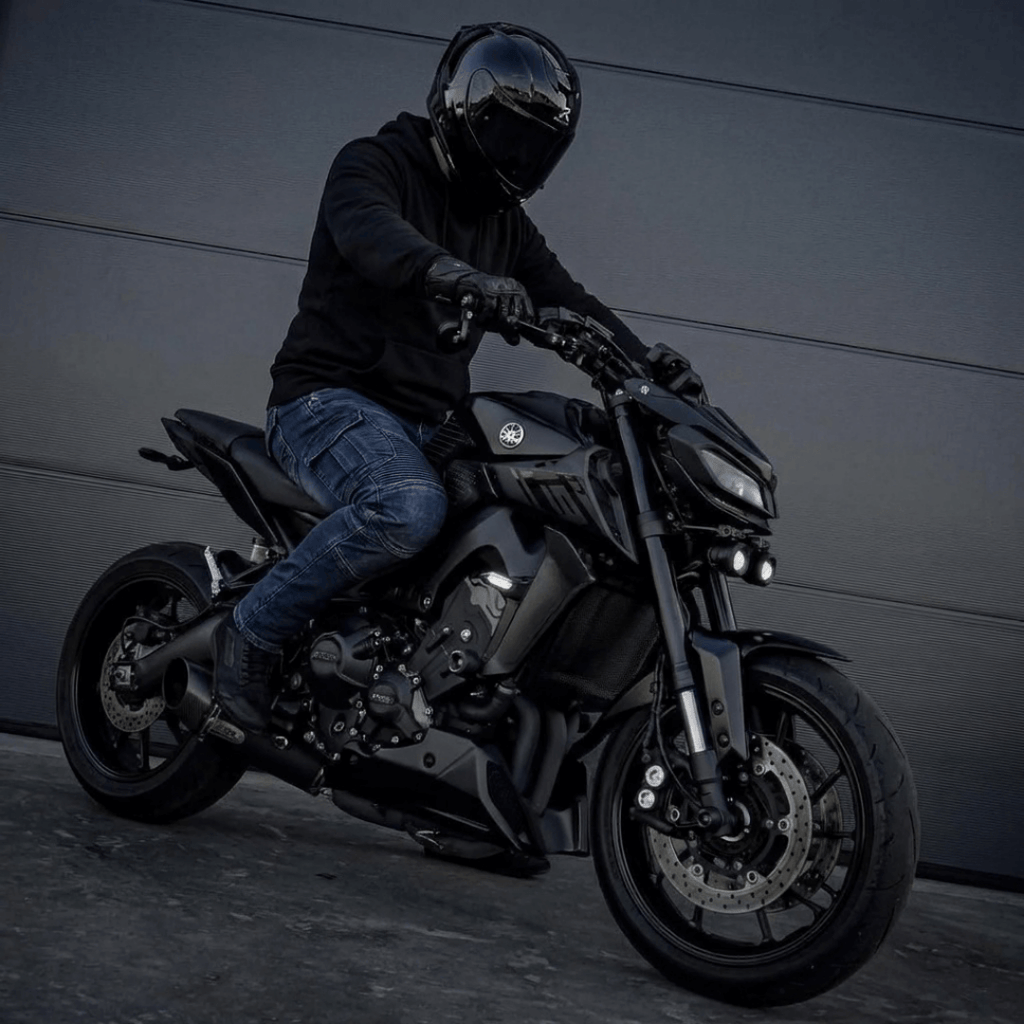 Rider on a naked bike wearing the Warden Riding Jean