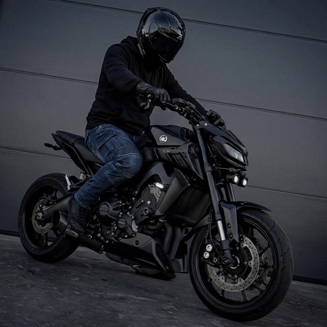 Rider on a naked bike wearing the Warden Riding Jean