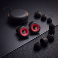 WARDEN moto earplugs, travel case and ear-tips on a dark premium surface